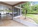 Inviting screened patio with ceiling fans overlooking a landscaped backyard at 905 N Lake Claire Cir, Oviedo, FL 32765