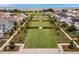 Scenic aerial view of common lawn space between homes with mature trees and landscaping at 908 Tilden Oaks Trl, Winter Garden, FL 34787