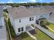 An aerial view of the two story white home and landscaped grounds at 908 Tilden Oaks Trl, Winter Garden, FL 34787