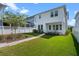 Manicured backyard lawn, fence, and landscaped area at 908 Tilden Oaks Trl, Winter Garden, FL 34787