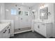Modern bathroom with a glass-enclosed shower, dual vanities, and sleek finishes at 908 Tilden Oaks Trl, Winter Garden, FL 34787