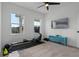 Bedroom with a TV, fitness equipment, a ceiling fan, and bright windows at 908 Tilden Oaks Trl, Winter Garden, FL 34787