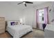 Bedroom with a desk, chair, bed, nightstand, and colorful decorations at 908 Tilden Oaks Trl, Winter Garden, FL 34787