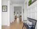Bright entryway featuring hardwood floors, white walls, and views into other living spaces at 908 Tilden Oaks Trl, Winter Garden, FL 34787
