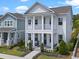 Charming two-story home showcasing a double porch, columns, and swing at 908 Tilden Oaks Trl, Winter Garden, FL 34787
