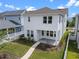 A charming two-story home with a front yard and sidewalk at 908 Tilden Oaks Trl, Winter Garden, FL 34787
