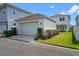 A white detached garage with driveway at 908 Tilden Oaks Trl, Winter Garden, FL 34787