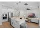 Stylish open-concept kitchen with stainless steel appliances and a view into the living room at 908 Tilden Oaks Trl, Winter Garden, FL 34787