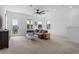 Cozy living room with ample seating and natural light from the large balcony doors and windows at 908 Tilden Oaks Trl, Winter Garden, FL 34787