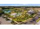 Resort-style pool area with lush landscaping, lounge chairs, and a covered pavilion at 908 Tilden Oaks Trl, Winter Garden, FL 34787