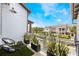Relaxing outdoor balcony featuring green plants, patio furniture and neighborhood views at 9255 Doherty Pl, Orlando, FL 32827