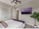 This comfortable main bedroom features wood floors, a ceiling fan and an ensuite bath at 9255 Doherty Pl, Orlando, FL 32827