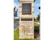 Stone sign marking the entrance to Lake Nona's Laureate Park neighborhood with manicured landscaping at 9255 Doherty Pl, Orlando, FL 32827