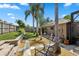 Secluded backyard seating area with lush landscaping and stone retaining wall at 97 Desiree Aurora St, Winter Garden, FL 34787