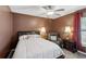 Comfortable bedroom with a plush recliner, soft lighting, and a queen size bed at 97 Desiree Aurora St, Winter Garden, FL 34787