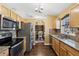 Open kitchen featuring stainless steel appliances, granite countertops, and hardwood flooring at 97 Desiree Aurora St, Winter Garden, FL 34787