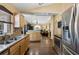 Open kitchen featuring stainless steel appliances, granite countertops, and hardwood flooring at 97 Desiree Aurora St, Winter Garden, FL 34787