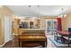 Open kitchen area featuring modern appliances, connecting seamlessly to dining and living spaces at 97 Desiree Aurora St, Winter Garden, FL 34787