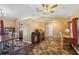 Inviting living room with a ceiling fan, unique flooring, and charming archways for seamless transitions at 97 Desiree Aurora St, Winter Garden, FL 34787