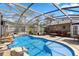 A sparkling screened pool with rock features in a private backyard setting at 97 Desiree Aurora St, Winter Garden, FL 34787