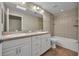 Bathroom featuring double sinks, tile flooring, a tub shower, and ample counter space at 1005 Turkey Hollow Cir, Winter Springs, FL 32708