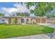 Charming home featuring a well-maintained lawn, a two car garage, and enhanced curb appeal at 1005 Turkey Hollow Cir, Winter Springs, FL 32708