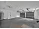 Spacious two-car garage with painted walls, concrete flooring, and ample space for parking and storage at 1005 Turkey Hollow Cir, Winter Springs, FL 32708