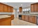 This kitchen offers wood cabinets, modern appliances, and plenty of prep space at 1005 Turkey Hollow Cir, Winter Springs, FL 32708