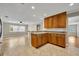 This kitchen provides wood cabinets, granite countertops, and an open layout to the living room at 1005 Turkey Hollow Cir, Winter Springs, FL 32708