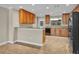 This kitchen features wood cabinets, modern appliances, and lots of counter space at 1005 Turkey Hollow Cir, Winter Springs, FL 32708