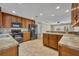 This kitchen features wood cabinets, modern appliances, and opens to a living area at 1005 Turkey Hollow Cir, Winter Springs, FL 32708