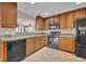 This kitchen features wood cabinets, modern appliances, and ample counter space at 1005 Turkey Hollow Cir, Winter Springs, FL 32708