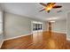 Spacious living room with hardwood floors and neutral tones, seamlessly connecting to the dining area at 1005 Turkey Hollow Cir, Winter Springs, FL 32708