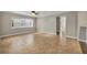 Spacious living room featuring tile flooring, a ceiling fan, and a large window for ample natural light at 1005 Turkey Hollow Cir, Winter Springs, FL 32708
