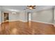 Open-concept living space with hardwood floors, offering a seamless transition to other areas of the home at 1005 Turkey Hollow Cir, Winter Springs, FL 32708
