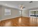 Spacious main bedroom featuring hardwood floors, ceiling fan, and natural light at 1005 Turkey Hollow Cir, Winter Springs, FL 32708