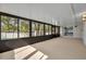 Enclosed patio with multiple sliding glass windows that allow for natural light and views of the beautiful backyard at 1005 Turkey Hollow Cir, Winter Springs, FL 32708
