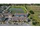 Aerial view of community featuring lake, townhomes, and green spaces at 1065 Clifton Springs Ln, Winter Springs, FL 32708