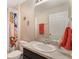 Bright bathroom featuring a vanity with a solid surface countertop and a shower with a patterned curtain at 1065 Clifton Springs Ln, Winter Springs, FL 32708