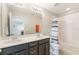 Bathroom features double sinks, a large mirror, and a shower tub combination at 1065 Clifton Springs Ln, Winter Springs, FL 32708