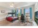 A bright bedroom with a bunk bed, ceiling fan, and views of the neighborhood at 1065 Clifton Springs Ln, Winter Springs, FL 32708