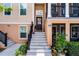 Inviting entrance showcasing steps leading to the front door with a lovely wreath at 1065 Clifton Springs Ln, Winter Springs, FL 32708