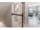 Bright hallway featuring a staircase, powder room, and access to a cozy living room at 1065 Clifton Springs Ln, Winter Springs, FL 32708