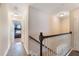 Upstairs hallway with hardwood floors and access to a bedroom with bunk beds at 1065 Clifton Springs Ln, Winter Springs, FL 32708