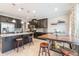 Spacious kitchen boasts dark cabinetry, granite countertops, and ample counter space at 1065 Clifton Springs Ln, Winter Springs, FL 32708