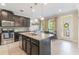 Bright kitchen featuring an island, granite countertops, and stainless steel appliances at 1065 Clifton Springs Ln, Winter Springs, FL 32708