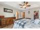 View of main bedroom showcases ceiling fan, ensuite bathroom, and large closet space at 1065 Clifton Springs Ln, Winter Springs, FL 32708