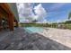 Community pool with brick pavers and seating at 1065 Clifton Springs Ln, Winter Springs, FL 32708
