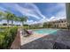 Community pool area with lounge chairs and palm trees at 1065 Clifton Springs Ln, Winter Springs, FL 32708