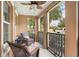 Screened-in porch offers outdoor seating and views at 1065 Clifton Springs Ln, Winter Springs, FL 32708